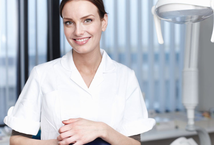 Dental assistant smiling in a dental office