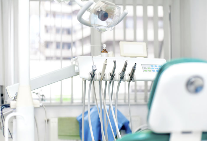 Modern dental clinic with tools, patient chair and equipment