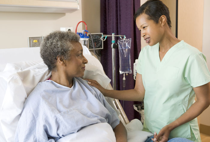 Medical Assistant talking with a patient.