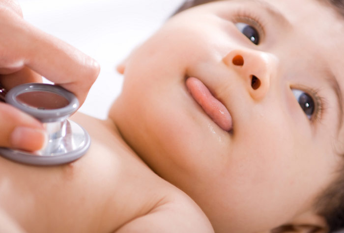 Baby with stethoscope on chest