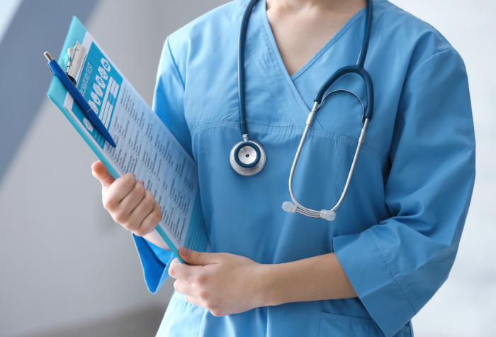 medical assistant holding a clipboard